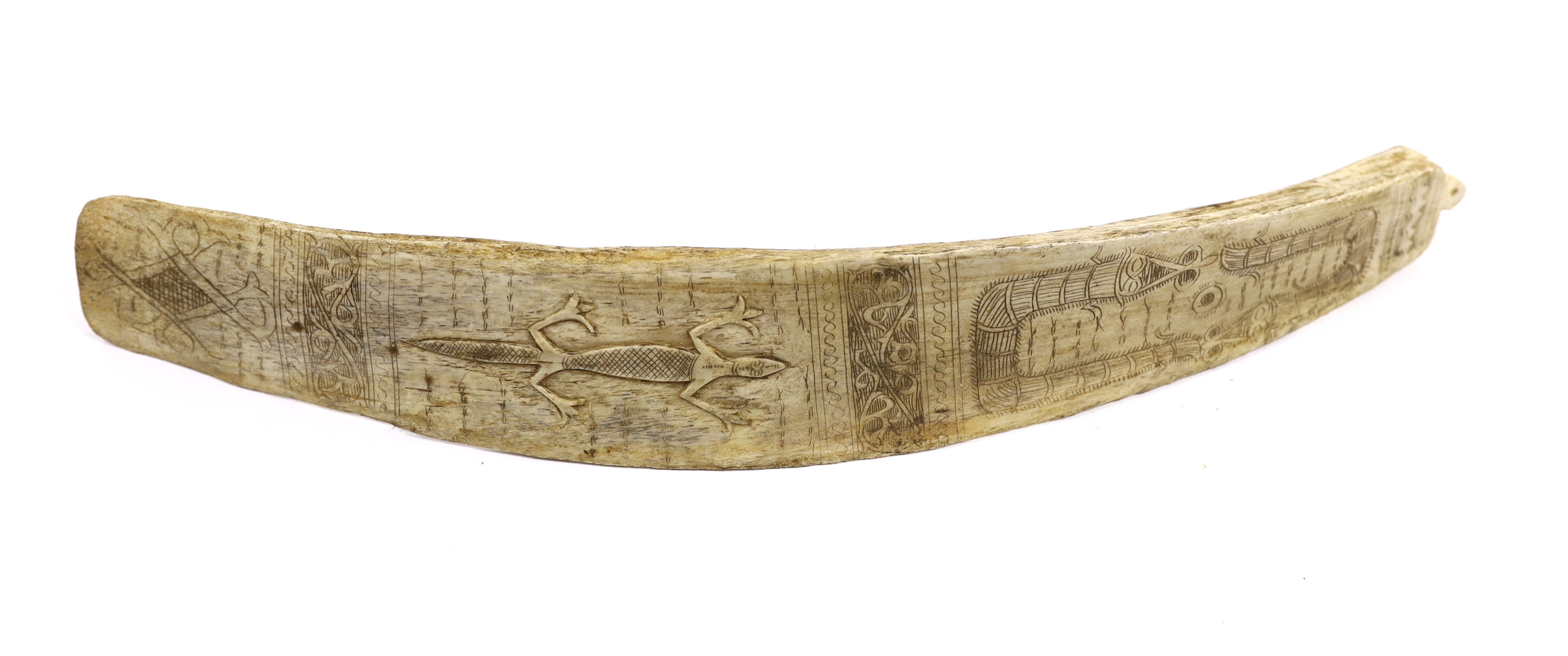 A late 19th/early 20th century Indonesian, Sumatran, carved buffalo rib calendar, Batak, 37cm